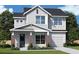 Two-story house with gray siding, brick accents, and a two-car garage at 1701 Ferris Ave, Orlando, FL 32803