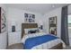 Well-lit bedroom with wood headboard and blue bedding at 1924 Rosewood Cir, Lakeland, FL 33810