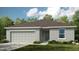 One-story home with gray siding and two-car garage at 1924 Rosewood Cir, Lakeland, FL 33810