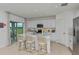 Bright kitchen with island and sliding glass doors to patio at 1924 Rosewood Cir, Lakeland, FL 33810