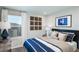 Bedroom with a navy and white striped comforter and large window at 1944 Rosewood Cir, Lakeland, FL 33810