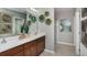 Double vanity bathroom with walk-in shower and stylish decor at 2018 Babbling Brook Blvd, Auburndale, FL 33823