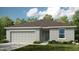 Single-story home with a two-car garage and landscaped lawn at 2018 Babbling Brook Blvd, Auburndale, FL 33823