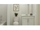 Simple bathroom with white vanity and fixtures at 2478 Mckinley Dr, Lake Wales, FL 33859