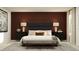 Elegant bedroom with a plush bed, dark accent wall, and stylish nightstands at 2478 Mckinley Dr, Lake Wales, FL 33859