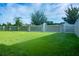 Spacious backyard with grassy lawn and privacy fence at 2871 Parkfield Rd, St Cloud, FL 34772