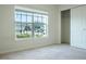 Bedroom with a large window and walk-in closet at 2871 Parkfield Rd, St Cloud, FL 34772