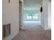 View down a hallway with neutral-toned walls and carpet at 2871 Parkfield Rd, St Cloud, FL 34772