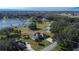 Aerial view of a house near a lake, showing the surrounding neighborhood and landscape at 958 Lake Deeson Pt, Lakeland, FL 33805