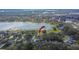Aerial view showcases the property in its lakeside neighborhood at 958 Lake Deeson Pt, Lakeland, FL 33805