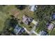 An aerial view of a house and surrounding area. The property has a large backyard at 958 Lake Deeson Pt, Lakeland, FL 33805