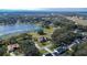 Aerial view of a house near a lake, showing the surrounding neighborhood and landscape at 958 Lake Deeson Pt, Lakeland, FL 33805