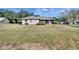 Spacious backyard with mature trees and lush landscaping at 958 Lake Deeson Pt, Lakeland, FL 33805