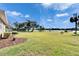 Spacious backyard featuring a lake view and well-maintained lawn at 958 Lake Deeson Pt, Lakeland, FL 33805