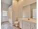 Bathroom featuring a white vanity with marble top and tub and shower combination at 958 Lake Deeson Pt, Lakeland, FL 33805