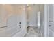 Clean bathroom with a bathtub and tiled floor at 958 Lake Deeson Pt, Lakeland, FL 33805