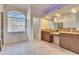 Bathroom boasts double vanity and granite countertop at 958 Lake Deeson Pt, Lakeland, FL 33805