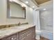 Bathroom with granite countertop, modern vanity, and shower at 958 Lake Deeson Pt, Lakeland, FL 33805