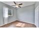 Spacious bedroom featuring wood-look floors and a window with a view at 958 Lake Deeson Pt, Lakeland, FL 33805