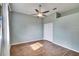 Bright bedroom with wood-look floors and ceiling fan at 958 Lake Deeson Pt, Lakeland, FL 33805