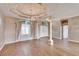 Elegant entryway with wood floors, stylish columns, and a view of the front door at 958 Lake Deeson Pt, Lakeland, FL 33805