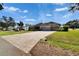 Spacious house with a large driveway and well maintained lawn at 958 Lake Deeson Pt, Lakeland, FL 33805