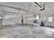 Spacious two car garage with concrete floor and white walls features ample storage and utility connections at 958 Lake Deeson Pt, Lakeland, FL 33805