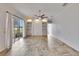 Bright Gathering room featuring tile floors, built-in shelving, and sliding glass doors at 958 Lake Deeson Pt, Lakeland, FL 33805