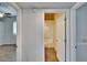 Hallway featuring a view into a bathroom with a shower and tub at 958 Lake Deeson Pt, Lakeland, FL 33805