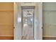 Hallway showing access to bedroom and walk-in closets at 958 Lake Deeson Pt, Lakeland, FL 33805
