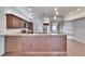 Beautiful kitchen with dark wood cabinets, stainless steel appliances, and a large island at 958 Lake Deeson Pt, Lakeland, FL 33805