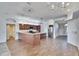 Open concept kitchen featuring wooden cabinets and a spacious island, with wood floors at 958 Lake Deeson Pt, Lakeland, FL 33805