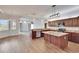 Spacious kitchen with wood floors, granite countertops, stainless appliances and center island at 958 Lake Deeson Pt, Lakeland, FL 33805