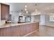 Spacious kitchen featuring granite countertops, wood cabinets, and wood flooring at 958 Lake Deeson Pt, Lakeland, FL 33805