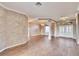 Bright, open living room featuring wood floors and a view of the front entrance at 958 Lake Deeson Pt, Lakeland, FL 33805