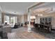 Open living room with wood floors, neutral paint, and elegant dining set near the kitchen at 958 Lake Deeson Pt, Lakeland, FL 33805