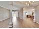 Spacious open-plan living room with wood floors connects to the kitchen and outdoor views at 958 Lake Deeson Pt, Lakeland, FL 33805