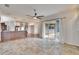 Living room features tile floors, kitchen access and sliding doors to patio at 958 Lake Deeson Pt, Lakeland, FL 33805