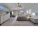 Luxurious main bedroom suite featuring sitting area, neutral decor, and large windows at 958 Lake Deeson Pt, Lakeland, FL 33805