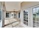 Large screened patio with brick flooring and multiple access points provides a great entertaining space at 958 Lake Deeson Pt, Lakeland, FL 33805