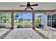 Spacious screened patio with paver floor and tranquil lake view at 958 Lake Deeson Pt, Lakeland, FL 33805