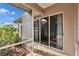 Relaxing screened patio with sliding glass doors and lush landscaping at 958 Lake Deeson Pt, Lakeland, FL 33805