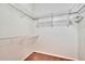 A walk-in closet with built-in shelving for optimal storage solutions at 958 Lake Deeson Pt, Lakeland, FL 33805