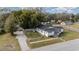 Aerial view highlighting the house and surrounding area at 100 Cordova Rd, Auburndale, FL 33823