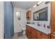 Updated bathroom with wood vanity and a shower/tub combo at 100 Cordova Rd, Auburndale, FL 33823