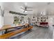 Open concept dining room with rustic wooden table at 100 Cordova Rd, Auburndale, FL 33823