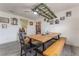 Bright dining area with a long wooden table and bench seating at 100 Cordova Rd, Auburndale, FL 33823