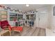 Bright entryway with shoe storage and comfy chair at 100 Cordova Rd, Auburndale, FL 33823