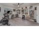 Spacious home office, featuring Peloton bike and built-in shelving at 100 Cordova Rd, Auburndale, FL 33823