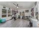 Bright home office or exercise room with Peloton bike and ample natural light at 100 Cordova Rd, Auburndale, FL 33823